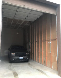 Black SUV parked inside a spacious 14x30 storage unit