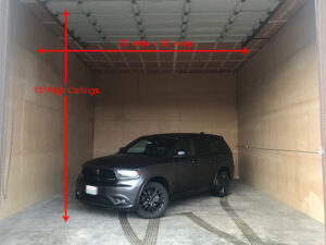 Black SUV parked inside a spacious storage unit with dimensions labeled: 20' wide, 30' deep, 15' high ceilings.